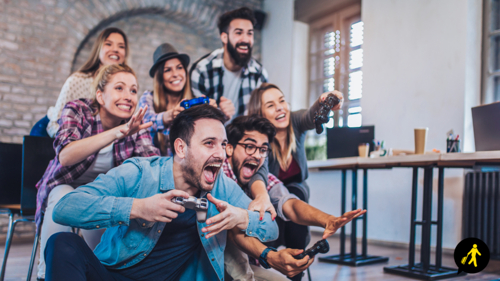 A team playing a video game together as a team building activity.