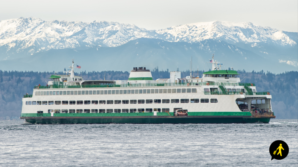 Edmond - Kingston ferry in Washington State, US with mountains behind it.