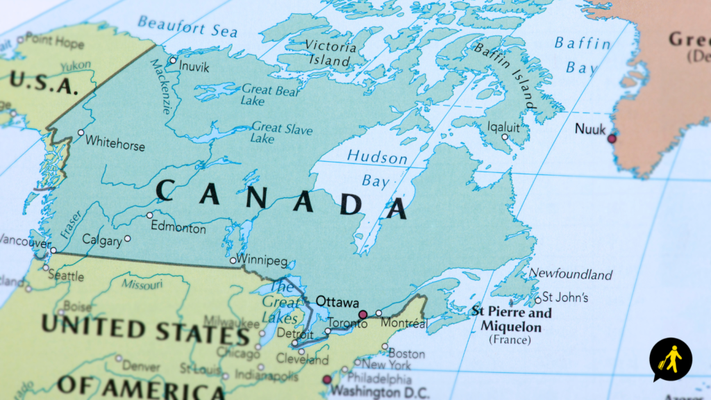 Map of Canada showing Canada in a forest green, the USA in a light green and the let half of Greenland in a washed-out orange.